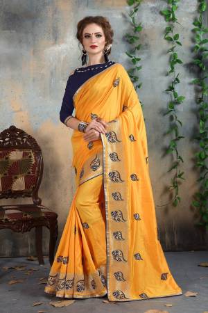 Here Is A Beautiful Designer Saree With Attractive Color Combination Is Yellow Colored Saree Paired With Contrasting Navy Blue Colored Blouse. This Saree And Blouse Are Fabricated On Art Silk which Also Gives a Rich Look To Your Personality. Buy Now.