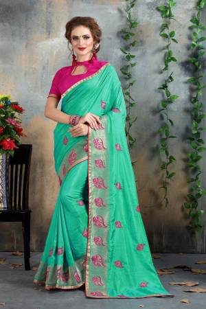 Grab This Beautiful Shade In Green With This Sea Green Colored Saree Paired With Contrasting Magenta Pink Colored Blouse. This Saree And Blouse Are Fabricated On Art Silk Beautified With Jari And Thread Work. This Saree Is Easy To Drape And Durable.