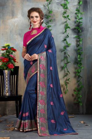 For A Bold And Beautiful Personality, Grab This Saree In Navy Blue Color Paired With Contrasting Magenta Pink Colored Blouse. This Saree And Blouse Are Fabricated On Art Silk Beautified With Jari And Thread Embroidery All Over It. 