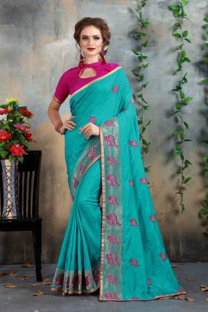 Very Pretty Shade In Blue Is Here With This Saree In Turquoise Blue Color Paired With Contrasting Dark Pink Colored Blouse. This Saree And Blouse Are Fabricated On Art Silk  Beautified With Jari And Thread Embroidery All Over It. Buy Now.