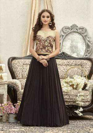 Grab This Beautiful Designer Readymade Gown In Brown And Cream Color Fabricated On Fancy Fabric Beautified With Stone Work. This Pretty Gown Is Comfortable To Wear And Easy To Carry Throught Out The Gala.