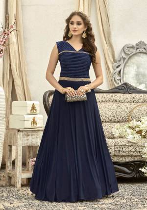 Enhance Your Beauty Wearing This Designer Floor Length Gown In Navy Blue Color Fabricated On Fancy Fabric Beaurtified With Hand Work. This Gown Ensures Superb Comfort All Day Long. Buy Now.