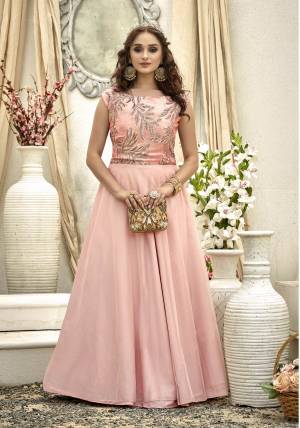 Look Pretty In This Lovely Baby Pink Colored Floor Length Gown Fabricated On Fancy Fabric Beautified With Sequence Work. This Gown Is Light Weight And Easy To Carry All Day Long.,