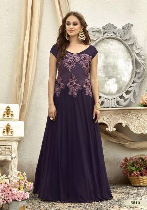 Get Ready For The Upcoming Wedding And Festive Season With This Designer Floor Length Gown In Purple Color Fabricated On Fancy Fabric. This Readymade Gown Is Soft Towards Skin And Easy To Carry Throughout The Gala.