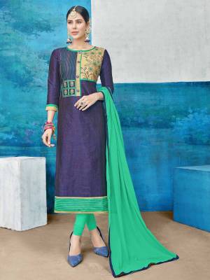 Grab This Dress Material In Navy Blue Colored Top Paired With Contrasting Sea Green Colored Bottom And Dupatta. Its Top Is Fabricated On Cotton Silk Paired With Cotton Bottom And Chiffon Dupatta. Get This Stitched As Per Your Desired Fit And Comfort.