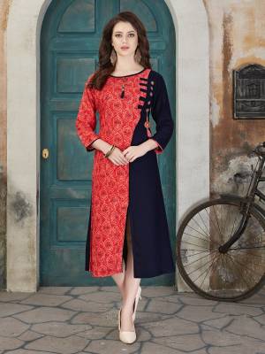 For Your College Wear, Semi Casuals Or For An Outing, Grab This Readymade Kurti In Red And Blue Color Fabricated On Rayon Cotton. It Is Beautified With Prints. Also It Is Light Weight And Easy To Carry All Day Long.