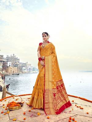 For A Proper Traditional Look, Grab This Attractive Saree In Yellow Color Paired With Contrasting Red Colored Blouse. This Saree And Blouse Are Fabricated On Banarasi Art Silk Beautified With Weave All Over It. Its Rich Fabric And Color Combination Will Earn You Lots Of Compliments From Onlookers.