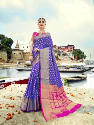 New Shade Is Here With This Saree In Violet Color Paired With Contrasting Fuschia Pink Colored Blouse. This Saree And Blouse Are Fabricated On Banarasi Art Silk Beautified With Weave All Over It. It Is Light In Weight And Easy To Drape.
