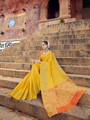 This Summer, Look A Little Brighter Wearing this Bright Colored Saree In Yellow Paired With Contrasting Orange Colored Blouse. This Saree And Blouse Are Fabricated On Banarasi Art Silk Beautified With Weave All Over It. Buy This Saree Now.