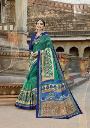 Add This New Shade In Green To Your Wardrobe With this Saree In Teal Green Color Paired With Contrasting Royal Blue Colored Blouse. This Saree Is Fabricated On Super Net Cotton paired With Art Silk fabricated Blouse. Its Lovely Fabric Is Durable And Easy To Care For.