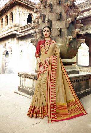 Flaunt Your Rich And Elegant Taste Wearing This Saree In Beige Color Paired With Red Colored Blouse. This Saree And Blouse Are Fabricated On Art Silk Beautified With Weave All Over. It Is Light Weight And Easy To Drape. Buy Now.