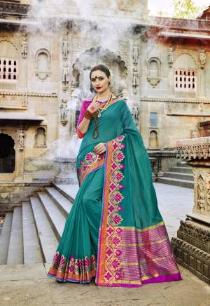 Grab This Beautiful Saree In Teal Blue Color Paired With Contrasting Rani Pink Colored Blouse. This Sarer And Blouse Are Fabricated On Art Silk Beautified With Weave Over The Broad Lace Border. Buy This Saree Now.
