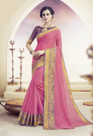 Look Pretty Wearing this Silk Saree In Light Pink Color Paired With Contrasting Violet Colored Blouse. This Saree And Blouse Are Fabricated On Art Silk Beautified Wiith Weave. Buy This Saree Now.