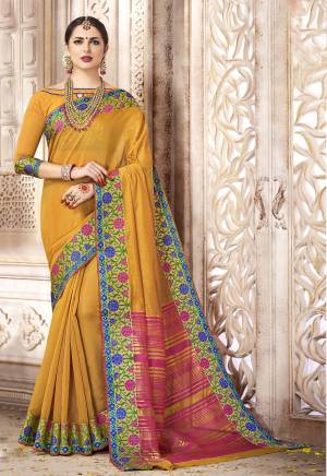 Celebrate This Fesive Season With Beauty And Comfort Wearing This Saree In Musturd Yellow Color Paired With Musturd Yellow Colored Blouse. This Saree And Blouse Are Fabricated On Art Silk Beautified With Weave over The Broad Lace Border. 