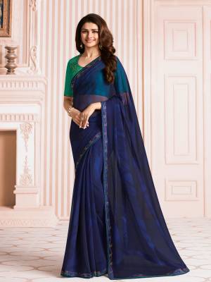 Enhance Your Personality Wearing This Saree In Navy Blue Color Paired With Contrasting Teal Green Colored Blouse. This Saree Is Fabricated On Georgette Paired With Art Silk Fabricated Blouse.  Buy This Saree Now.
