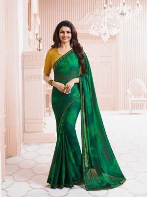 Celebrate This Festive Season Wearing This Saree In Green Color Paired With Contrasting Musturd Yellow Colored Blouse. This Saree Is Fabricated On Georgette Paired With Art Silk Fabricated Blouse.  This Saree Is Durable and Easy To Care For.