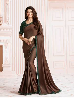 For A Rich And Elegant Look, Grab This Beautiful Saree In Dark Brown Color Paired With Contrasting Pine Green Colored Blouse. This Saree Is Fabricated On Georgette Paired With Art Silk Fabricated Blouse. Buy It Soon Before The Stock Ends.