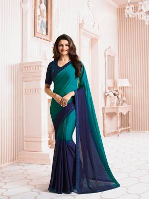 Shades Are In This Season, So Grab This Cool Colored Pallete Saree In Shades Of Blue Paired With Navy Blue Colored Blouse. This Saree Is Fabricated On Georgette Paired With Art Silk Fabricated Blouse. It Is Light In Weight And Easy To Carry All Day Long.