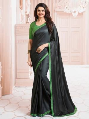 For A Bold And Beautiful Look, Grab This Saree In Black Color Paired With Green Colored Blouse. This Saree Is Fabricated On Georgette Paired With Art Silk Fabricated Blouse. It Is Light Weight, Easy To Drape And Carry All Day Long.