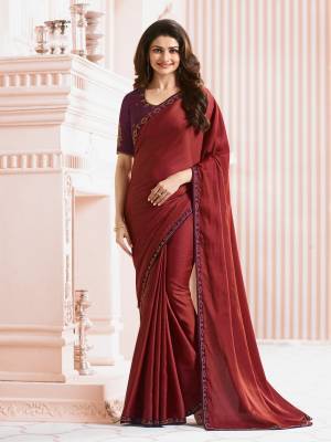Adorn The Lovely Angelic Look Wearing This Saree In Red Color Paired With Purple Colored Blouse. This Saree Is Fabricated On Georgette Paired With Art Silk Fabricated Blouse. Its Blouse And Saree Lace Border Is Beautified With Stone Work. Buy This Saree Now.
