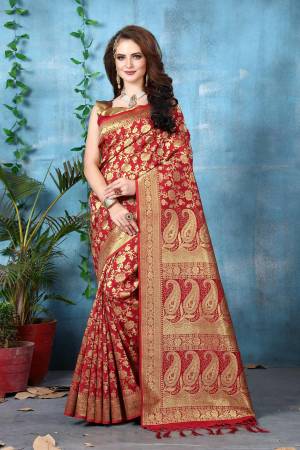 Adorn The Pretty Angelic Look Wearing This Saree In Red Color Paired With Red Colored Blouse. This Saree And Blouse Are Fabricated On Banarasi Art Silk Beautified With Weave All Over It. Grab This Attractive Saree Now.