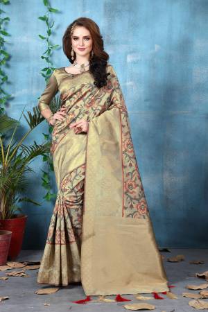 Flaunt Your Rich And Elegant Taste Wearing this Saree In Beige Color Paired With Beige Colored Blouse. This Saree And Blouse Are Fabricated On Banarasi Art Silk Beautified With Weave. Its Rich looking Color Will Definitely Earn You Lots Of Compliments From Onlookers.
