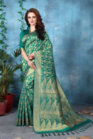 Add This Pretty Shade To Your Wardrobe Wearing This Saree In Teal Blue Color Paired With Teal Blue Colored Blouse. This Saree And Blouse Are Fabricated On Banarasi Art Silk Beautified With Weave All Over The Saree. Buy This Pretty Saree Now.