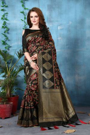 For A Bold and Beautiful Look, Grab This Saree In Black Color Paired With Black Colored Blouse. This Saree And Blouse Are Fabricated On Banarasi Art Silk Beautified With Weave All over. It Is Light Weight And Easy To Carry All Day Long.