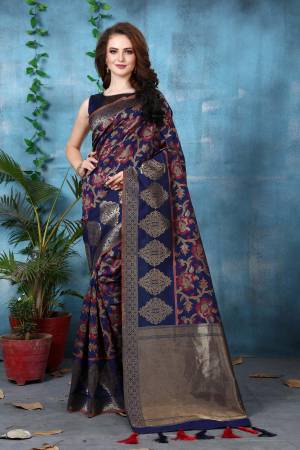 Enhance Your Personality Wearing This Silk Saree In Navy Blue Color Paired With Navy Blue Colored Blouse. This Saree And Blouse Are Fabricated On Banarsi Art Silk Beautified With Heavy Weave All Over It. Buy This Saree Now.