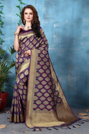 Celebrate This Festive Seaosn Wearing this Pretty Saree In Purple Color Paired With Purple Colored Blouse. This Saree And Blouse Are Fabricated On Banarasi Art Silk Beautified With Weave. Its Fabric Also Ensures Superb Comfort All Day Long. Buy Now.