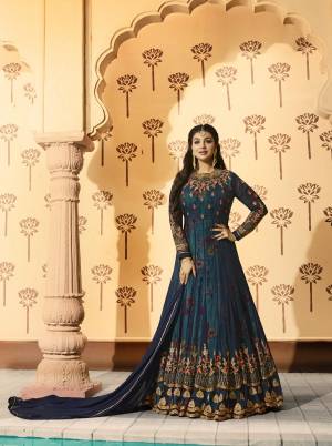 Enhance Your Personality Wearing This Designer Floor Length Suit In Dark Blue Color Paired With Dark Blue Colored Bottom And Dupatta. Its Top Is Fabricated On Georgette Paired With Santoon Bottom And Chiffon Dupatta. It Has Crepe Fabricated Inner Beautified With Floral Prints. Buy It Now.