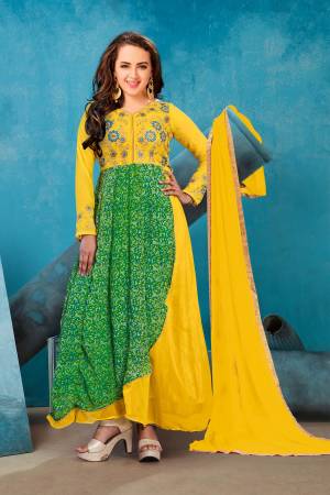 Celebrate This Festive Season Wearing This Designer Floor Length Suit In Green And Yellow Color Paired With Yellow Colored Bottom And Dupatta. Its Top Is Fabricated On Georgette Paired With Santoon Bottom And Chiffon Dupatta. This Suit Is Light In Weight And Easy to Carry All Day Long.