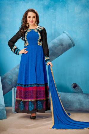 Shine Bright Wearing This Designer Floor Length Suit In Blue Color Paired With Blue Colored Bottom And Dupatta. Its Top Is Fabricated On Georgette Paired With Santoon Bottom And Chiffon Dupatta. This Suit Is Beautfiied With Prints And Embroidery. Buy Now.