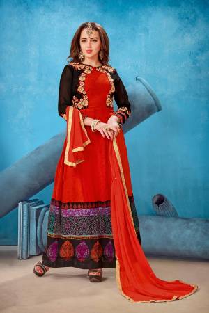 Adorn The Pretty Angelic Look, Wearing This Designer Floor Length Suit In Red Color Paired With Red Colored Bottom And Dupatta. Its Top Is Fabricated On Georgette Paired With Santoon Bottom And Chiffon Dupatta. Buy This Suit Now.