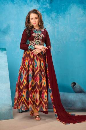 You Will Definitely Earn Lots of Compliments Wearing this Designer Floor Length Suit In Maroon Color Paired With Maroon Colored Bottom And Dupatta. Its Top Is Fabricated On Georgette Paired With Santoon Bottom And Chiffon Dupatta. All Three Fabrics Are Light Weight And Easy To Carry All Day Long.