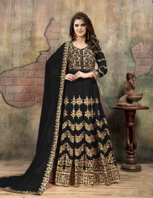 For A Bold And Beautiful Look, Grab This Heavy Designer Floor Length Suit In Black Color Paired With Black Colored Bottom And Dupatta. Its Top Is Fabricated On Georgette Paired With Santoon Bottom And Chiffon Dupatta. Its Has Heavy Jari Embroidery With Stone Work. Buy Now.