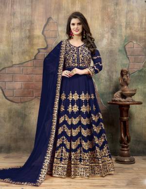Enhance Your Personality Wearing This Designer Floor Length Suit In Navy Blue Color Paired With Navy Blue Colored Bottom And Dupatta. Its Top Is Fabricated On Georgette Paired With Santoon Bottom And Chiffon Dupatta. It Is Beautified with Heavy Embroidery Over The Front And Back. Buy Now.