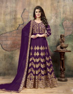 Look Beautiful Wearing This Designer Floor Length Suit In Purple Color Paired With Purple Colored Bottom And Dupatta. Its Top Is Fabricated On Georgette Paired With Santoon Bottom And Chiffon Dupatta. Its Heavy Embroidery Details Will Earn You Lots Of Compliments From Onlookers.