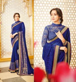 Shine Bright In This Attractive Royal Blue Colored Saree Paired With Royal Blue Colored Blouse. This Saree Is Fabricated On Georgette Paired With Net Fabricated Blouse. It Is Light In Weight And Easy To Carry All Day Long.