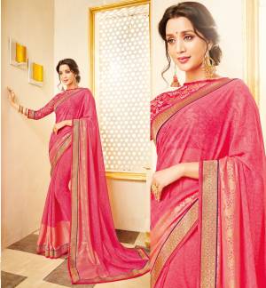 Look pretty In This Pink Colored Saree Paired With Pink Colored Blouse. This Saree Is Fabricated On Georgette Paired With Net Fabricated Blouse. Both Its Fabric Are Light Weight And easy To Carry all Day Long.