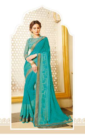 Simple and Elegant looking Saree IS Here In Turquoise Blue Color Paired With Turquoise Blue Colored Blouse. This Saree Is Fabricated On Georgette Paired With Net Fabricated Blouse. It Can Be Wear At Festive Or A Family Party.