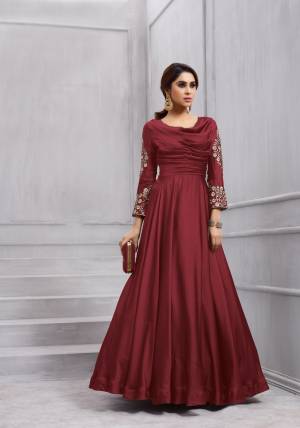 Adorn The Royal Look Wearing This Designer Floor Length Suit In Maroon Color Paired With Maroon Colored Bottom And Dupatta. Its Top Is Fabricated On Art Silk Paired With Santoon Bottom And Chiffon Dupatta. Its Top Is Readymade With Unstitched Bottom. Buy It Now.