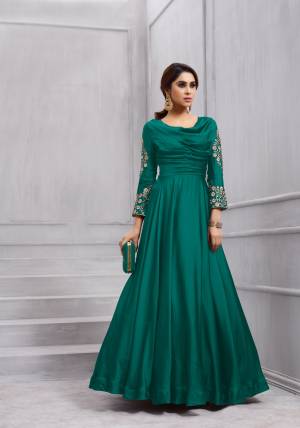 New And Unique Shade Is Here With This Designer Floor Length Suit In Teal Green Color Paired With Teal Green Colored Bottom And Dupatta. Its Top Is Fabricated On Art Silk Paired With Santoon Bottom And Chiffon Dupatta. Buy This Readymade Suit Now.