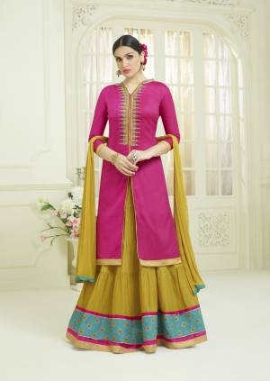 Go Colorful Wearing This Designer Lehenga Suit In Dark Pink Colored Top Paired With Contrasting Pear Green Lehenga And Dupatta. Its Top And Bottom Are Fabricated On Cotton Paired With Chiffon Dupatta. It Is Beautified With Multi Colored Thread Work. Buy It Now.