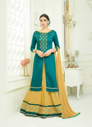 Celebrate This Festive Season Wearing This Designer Lehenga Suit In Teal Green Color Paired With Beige Colored Lehenga And Beige Colored Dupatta. Its Top And Lehenga Are Fabricated On Cotton Paired With Chiffon Dupatta. It Is Light Weight, Durable And Easy To Care For.