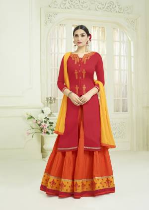 Add This Pretty Lehenga Suit In Red Colored Top Paired With Contrasting Orange Colored Lehenga Yellow Colored Dupatta. Its Top And Lehenga Are Fabricated On Cotton Paired With Chiffon Dupatta. Buy This Suit Now.