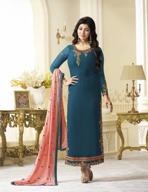 Grab This Beautiful Designer Straight Cut Suit In Blue Color Paired With Blue Colored Bottom And Contrasting Peach Colored Dupatta. Its Top Is Fabricated On Georgette Paired With Santoon Bottom And Chiffon Dupatta. This Suit Is Light In Weight And Easy To Carry All Day Long. 