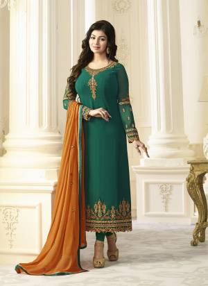 Here Is A Lovely Combination With This Designer Straight Cut Suit In Pine Green Color Paired With Pine Green Colored Bottom And Musturd Colored Dupatta. Its Top Is Fabricated On Georgette Paired With Santoon Bottom And Chiffon Dupatta. This Suit Will Definitely Earn You Lots Of Compliments From Onlookers.