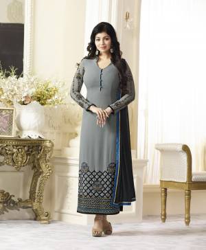 Add This Rich And Elegant Looking Deisgner Straight Cut Suit To Your Wardrobe In Grey Color Paired With Grey Colored Bottom And Black Colored Dupatta. Its Top Is Fabricated On Georgette Paired With Santoon Bottom And Chiffon Dupatta. Buy This Suit Now.