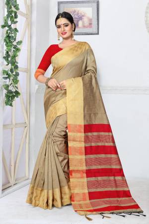 Flaunt Your Rich And Elegant Taste Wearing This Saree In Pale Khaki Color Paired With Contrasting Red Colored blouse. This Saree And Blouse Are Fabricated On Kanjivaram Art Silk. This Saree Is Light Weight And Easy To Carry All Day Long.
